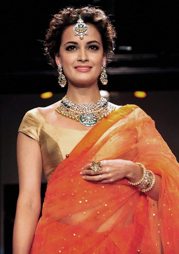 Bollywood actress Dia Mirza walks the ramp during the India International Jewellery Week (IIJW) in Mumbai.