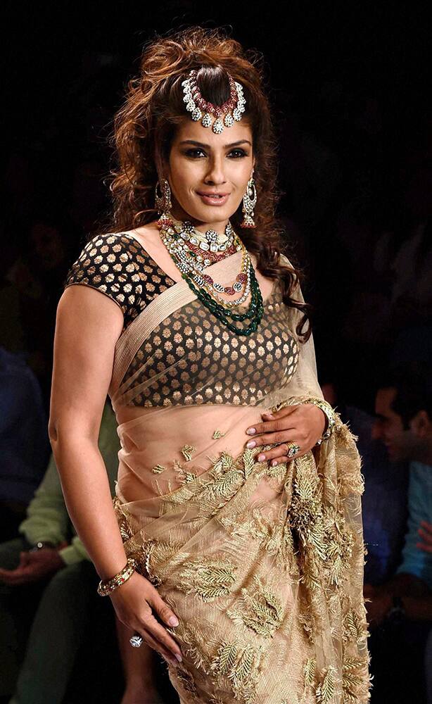 Bollywood actress Raveena Tandon displays a bridal jewllery collection during the India International Jewllery Week in Mumbai.