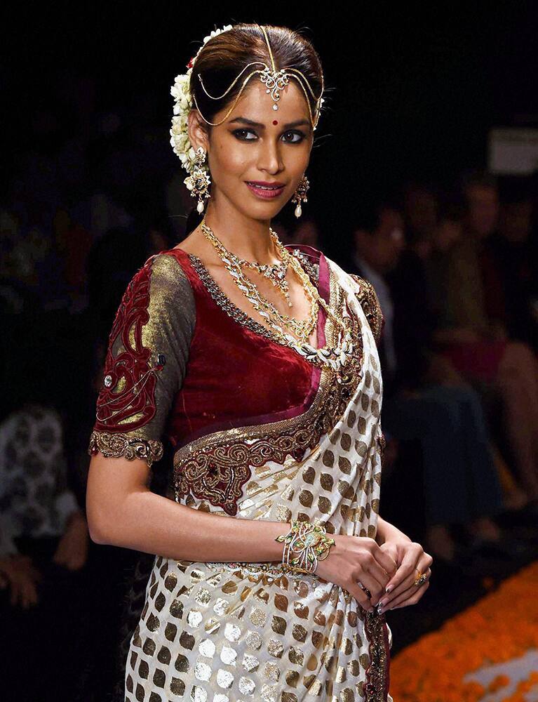 Former Miss India Amrita Patiki displays a bridal jewllery collection during the India International Jewllery Week in Mumbai.