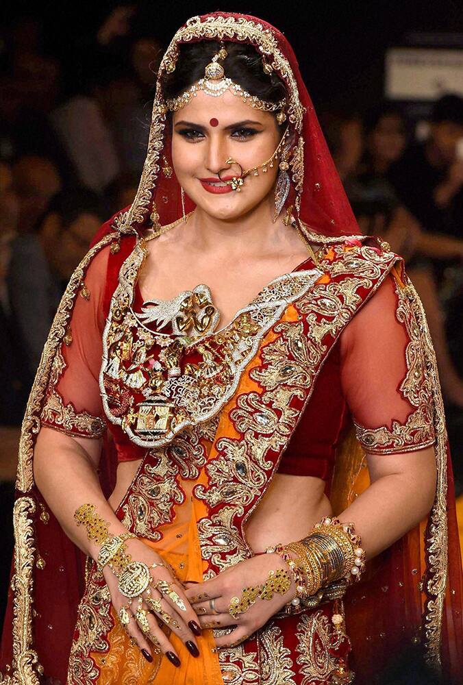 Bollywood actress Zarin Khan displays a bridal jewllery collection during the India International Jewllery Week in Mumbai.