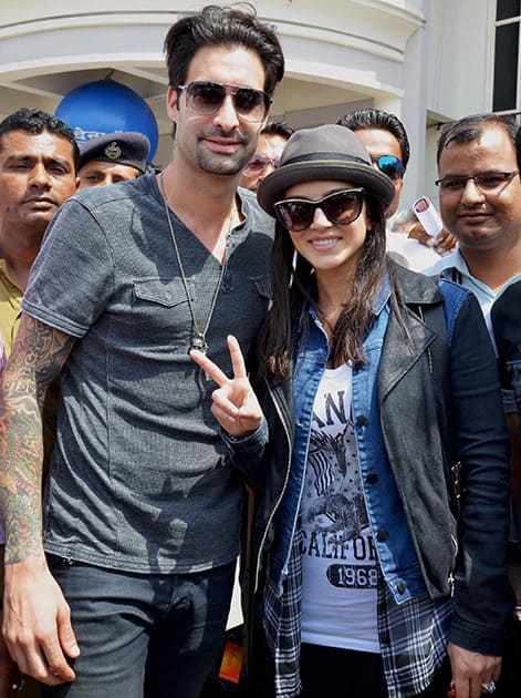 Sunny Leone with her husband Daniel Weber on her arrival at the airport in Jodhpur.