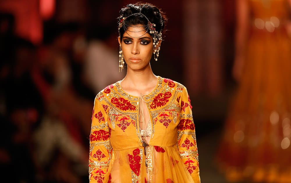 A model displays a dress created by Indian designer Anju Modi at the India Couture Week, held by Fashion Design Council of India, in New Delhi.