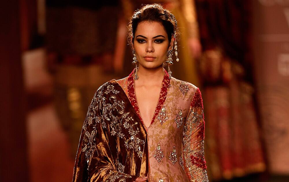 A model displays a dress created by Indian designer Anju Modi at the India Couture Week, held by Fashion Design Council of India, in New Delhi.