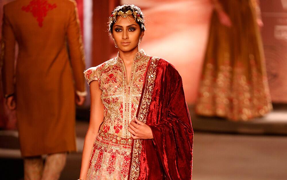 A model displays a dress created by Indian designer Anju Modi at the India Couture Week, held by the Fashion Design Council of India, in New Delhi.