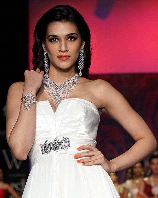 Bollywood actress Kriti Sanon displays jewellery during the India International Jewellery Week (IIJW) in Mumbai 