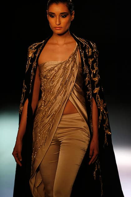 A model displays a dress created by Indian designer Gaurav Gupta at the India Couture Week, held by Fashion Design Council of India, in New Delhi.