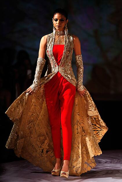 A model displays a dress created by Indian designer Gaurav Gupta at the India Couture Week, held by Fashion Design Council of India, in New Delhi.