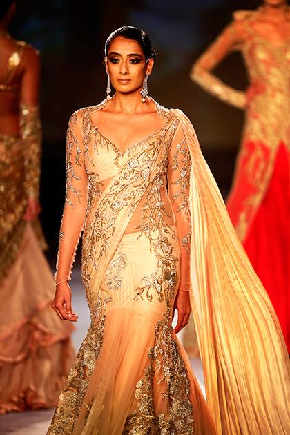 A model displays a dress created by Indian designer Gaurav Gupta at the India Couture Week, held by Fashion Design Council of India, in New Delhi.