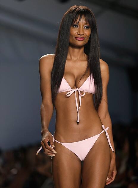 A model walks down the runway wearing swimwear designed by Wildfox during the Mercedes-Benz Fashion Week Swim show in Miami Beach, Fla.