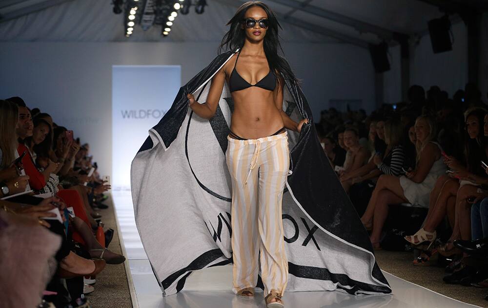 A model walks down the runway wearing swimwear designed by Wildfox during the Mercedes-Benz Fashion Week Swim show in Miami Beach, Fla.