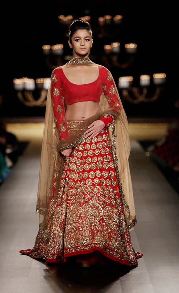 Bollywood actor Alia Bhatt walks the ramp at the India Couture Week 2014 in New Delhi.