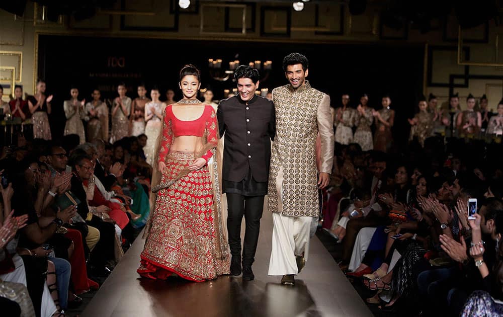 Bollywood actor Alia Bhatt, designer Manish Malhotra and actor Aditya Kapoor at the India Couture Week 2014 in New Delhi.