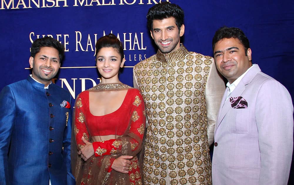 L-R Mr.Praveen Goel, Designer & CEO Shree Raj Mahal Jeweles with Alia Bhaat & Aditya Roy Kapoor & Mr. Ashok Goel at Shree  Raj Mahal  jewelers India Couture Week 2014.