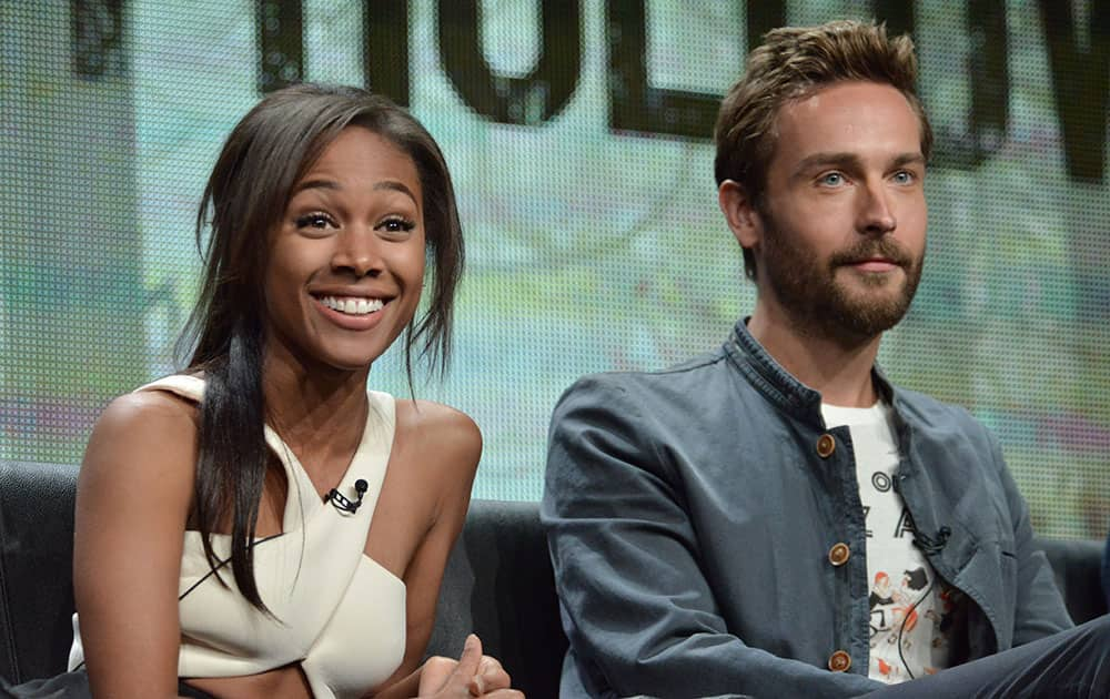 Nicole Beharie, left, and Tom Mison speaks on stage during the `Sleepy Hollow` panel at the The FOX 2014 Summer TCA held at the Beverly Hilton Hotel in Beverly Hills, Calif.