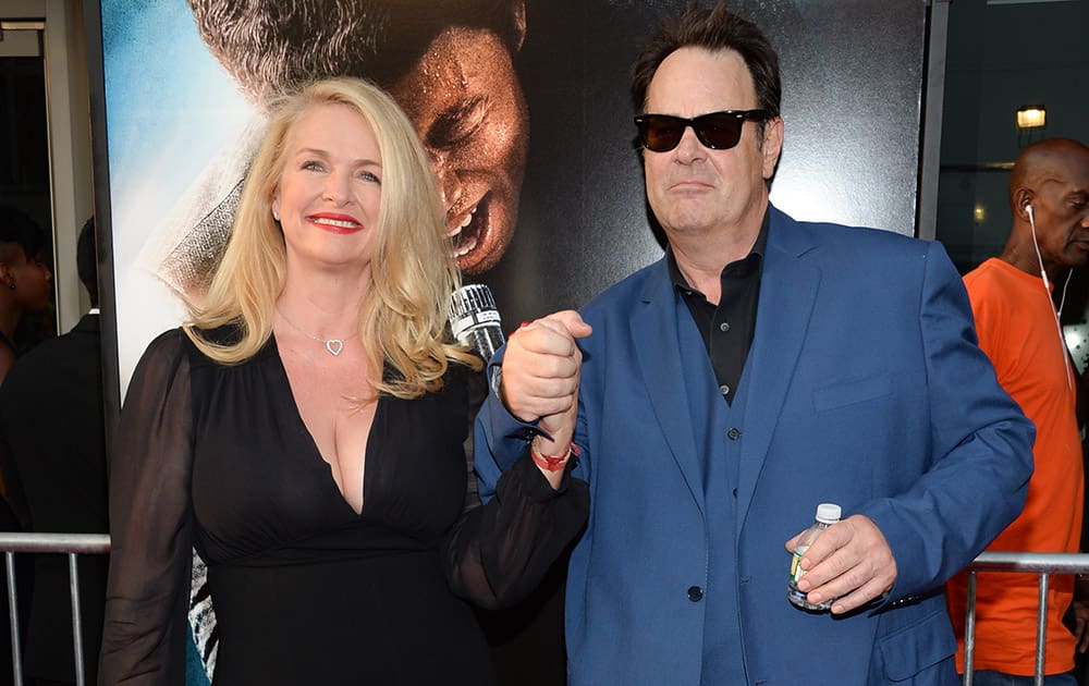 Donna Dixon, left, and Dan Aykroyd attend the world premiere of 