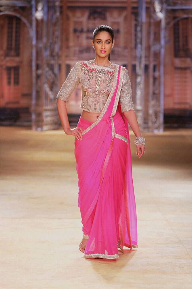 Bollywood actress Illeana D’ Cruz walks the ramp at India Couture Week 2014 in New Delhi.