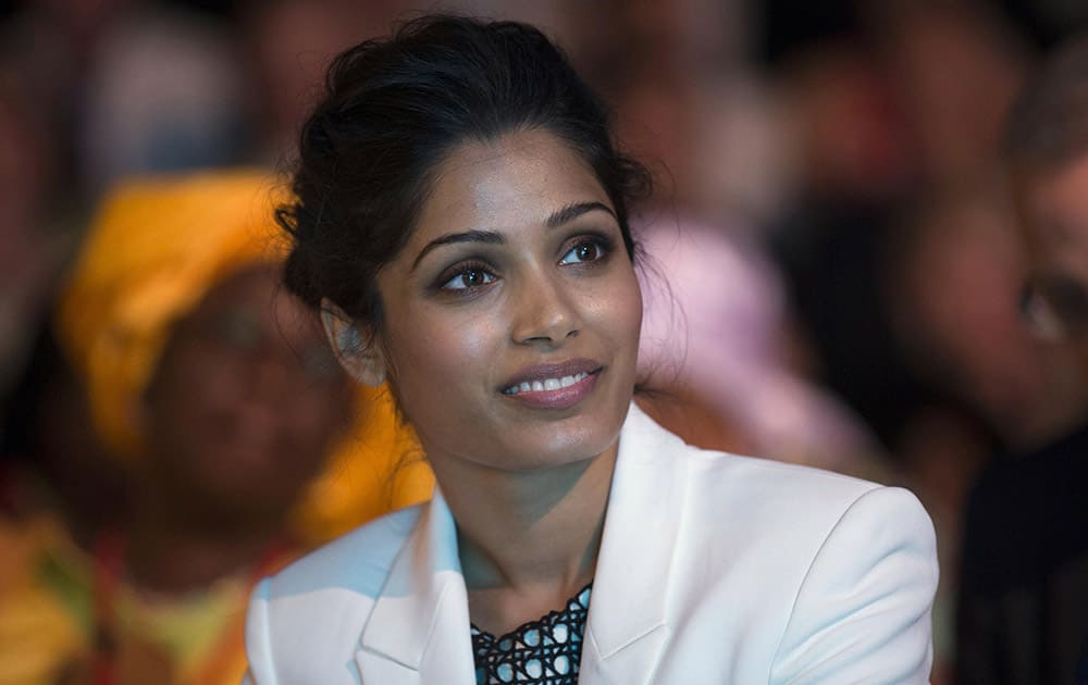 Indian actress Freida Pinto, smiles, during the Girl Summit 2014, at the Walworth Academy, in London. `Slumdog Millionaire` actress Freida Pinto has joined forces with girls’ rights campaigners calling for an end to the practice of female genital mutilation. 