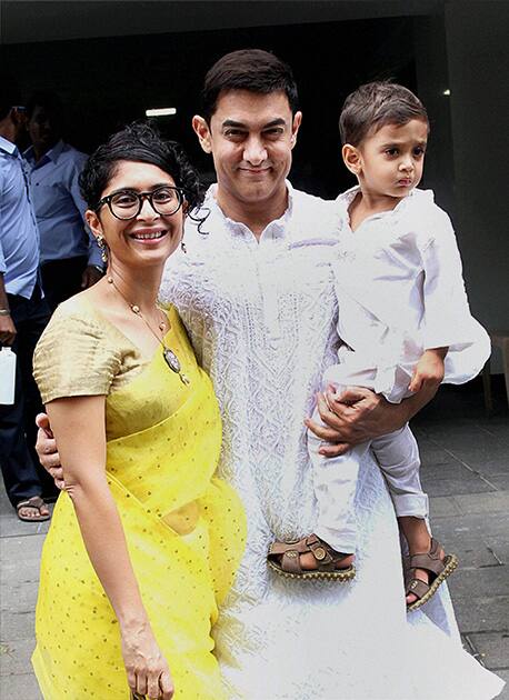 Bollywood actor Aamir Khan with his wife Kiran Rao and son Azad poses on the occasion of Eid al-Fitr celebrations at his residence in Mumbai.