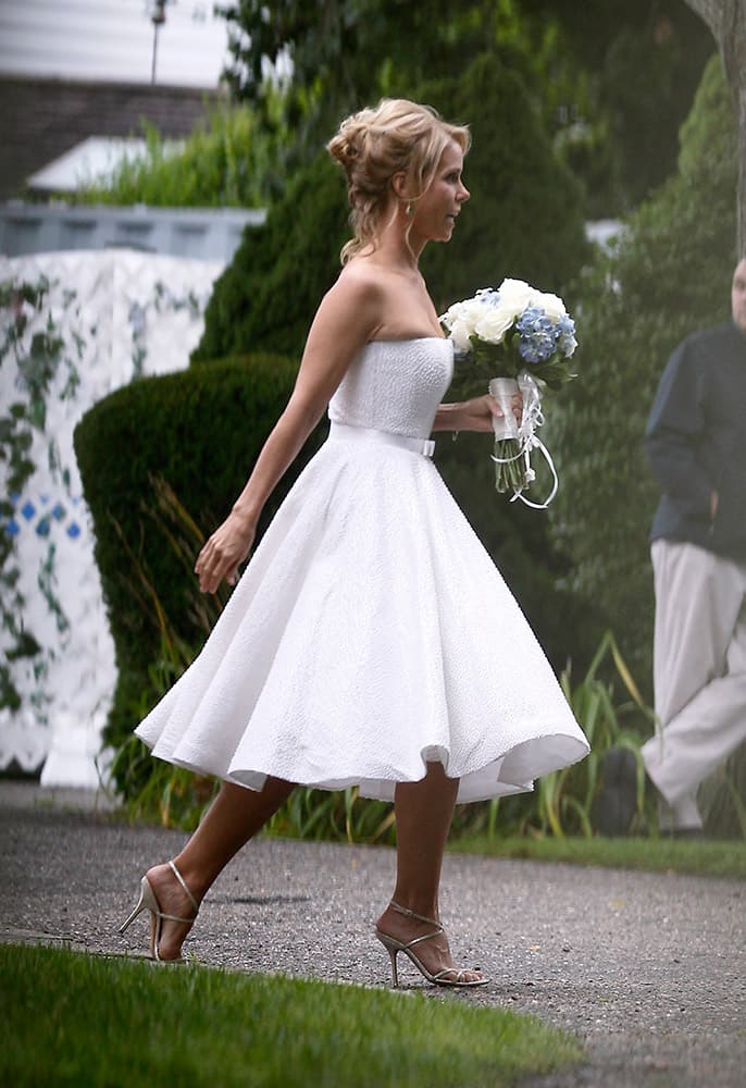 Actress Cheryl Hines walks across a lawn to the tent where her wedding to Robert F. Kennedy Jr., will take place in Hyannis Port, Mass.