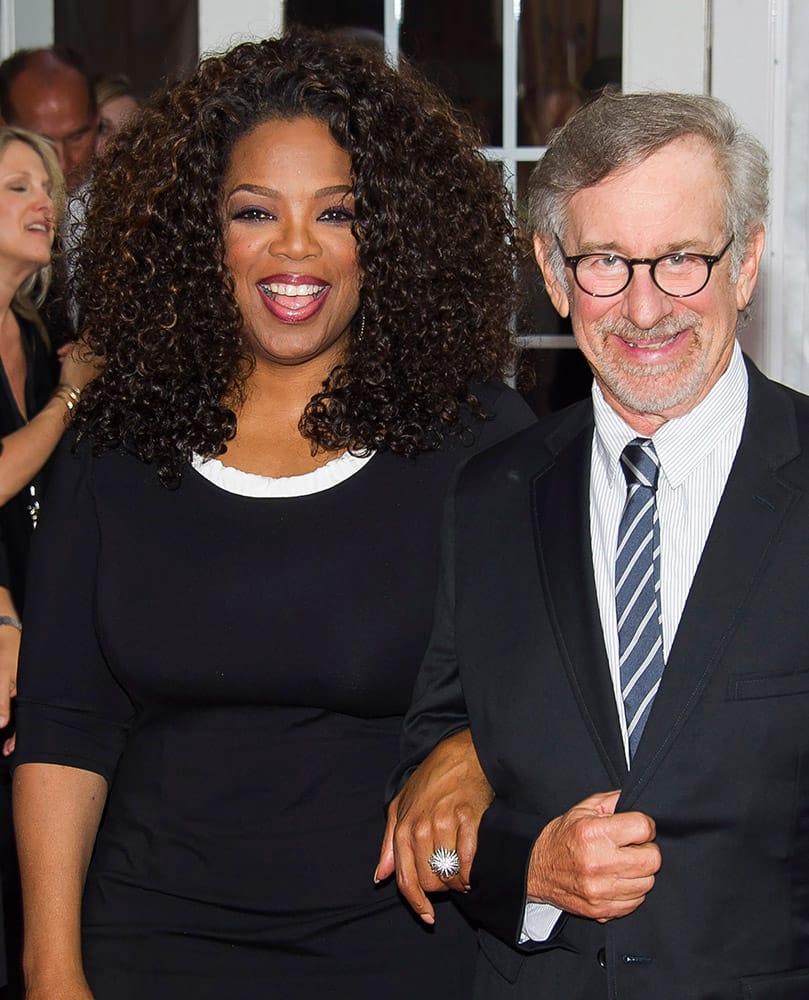 Producers Oprah Winfrey and Steven Spielberg, right, attend `The Hundred-Foot Journey` premiere in New York. 