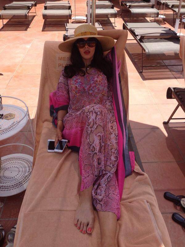 Mallika Sherawat - Lounging is so much fun;) Pic Courtesy: twitter