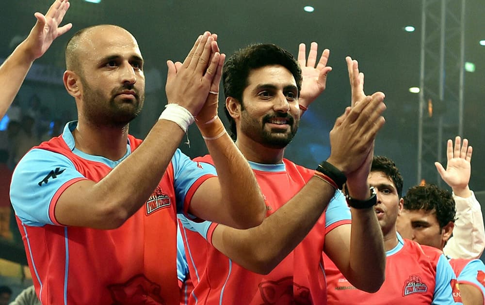 Actor Abhishek Bachachan (owner Pink Panthers' Jaipur team) with his team players after beating Delhi Dabang at a Pro-Kabaddi match in New Delhi.