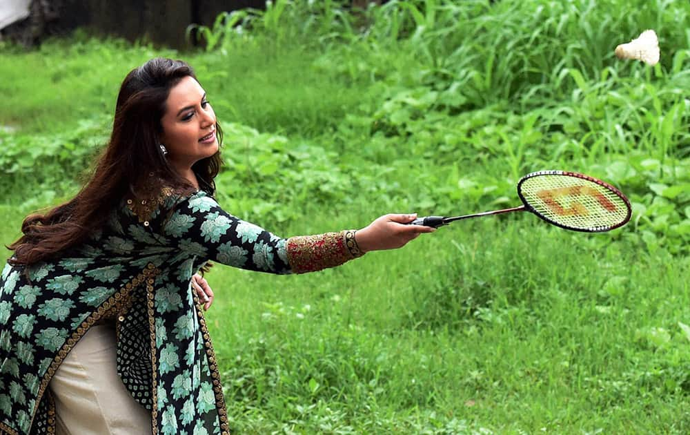 Actress Rani Mukerji plays badminton at a school during a promotional event in Mumbai.