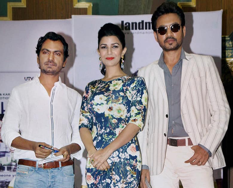 Bollywood actors Nawazuddin Siddiqui, Nimrat Kaur and Irrfan Khan during the DVD launch of their film 'Lunchbox', in Mumbai.