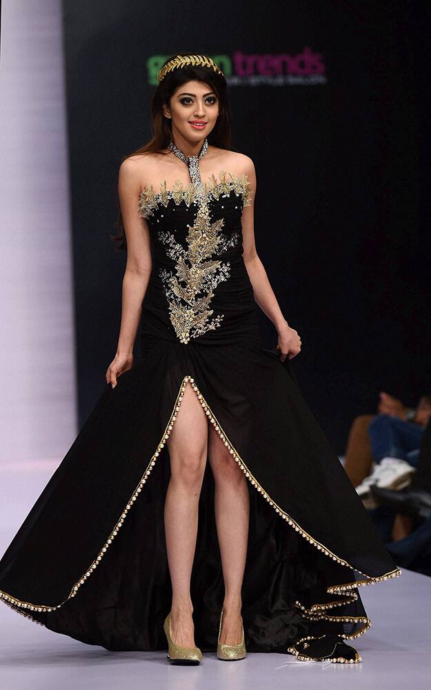 Actor Parneeta Subhash on the ramp to showcase the creation of designer Shivani Singh during the first day of Bangalore Fashion Week in Bengaluru.