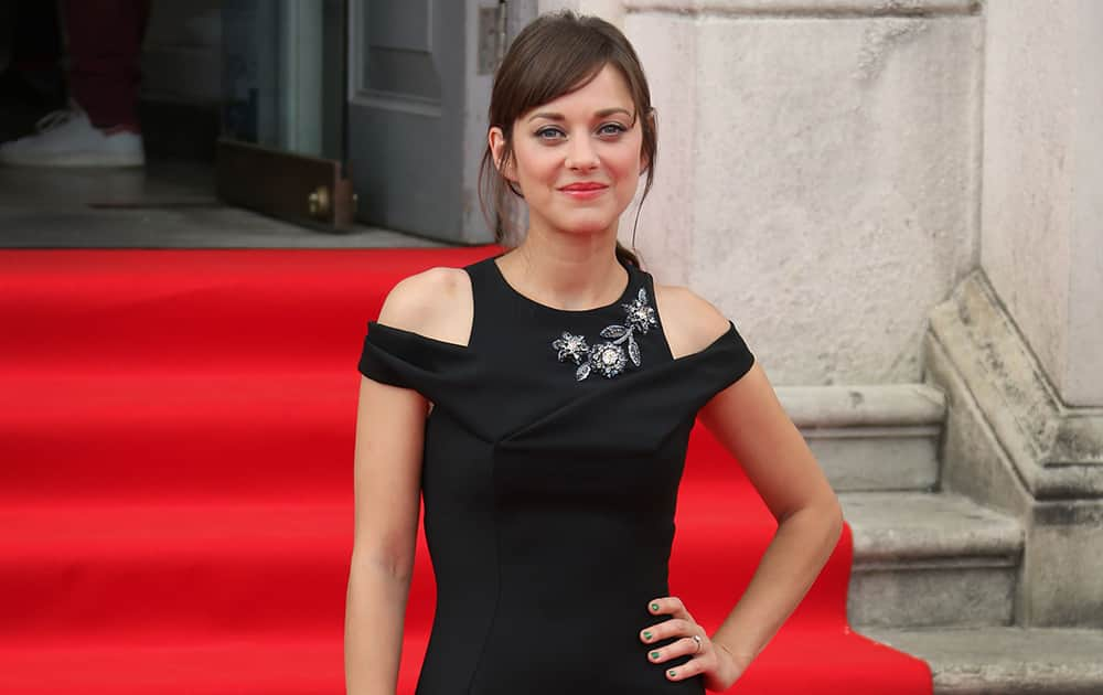 French actress Marion Cotillard arrives for the screening of Two Days, One Night at Somerset House in central London.