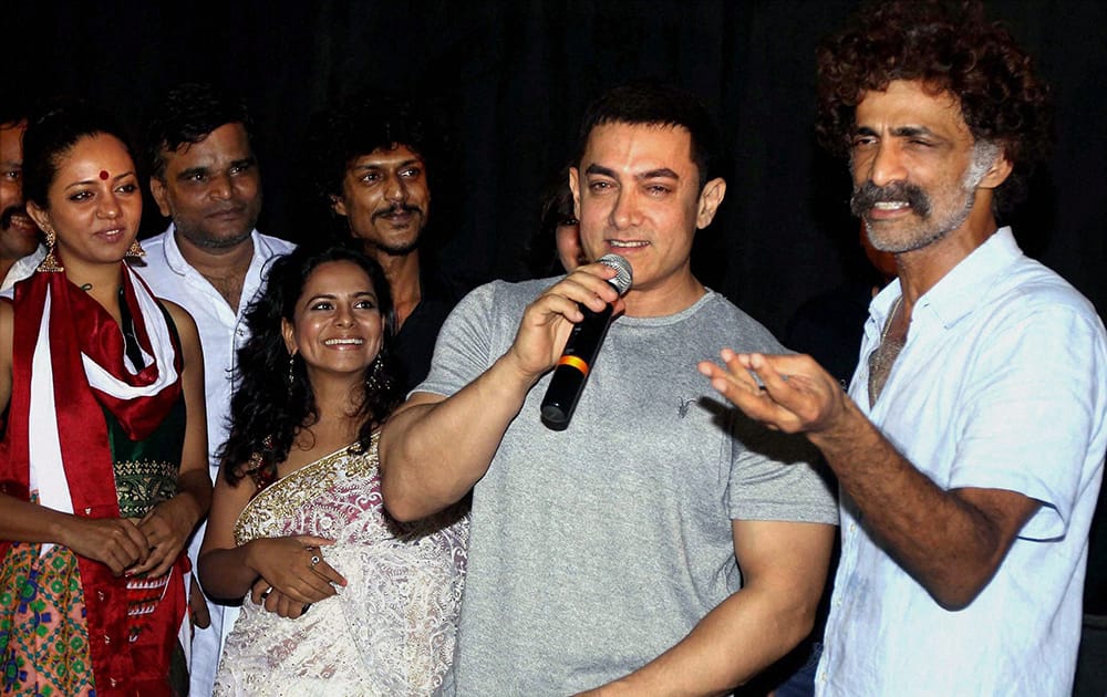 Bollywood actors Aamir Khan with Makarand Deshpande and cast during special screening of the Marathi film.