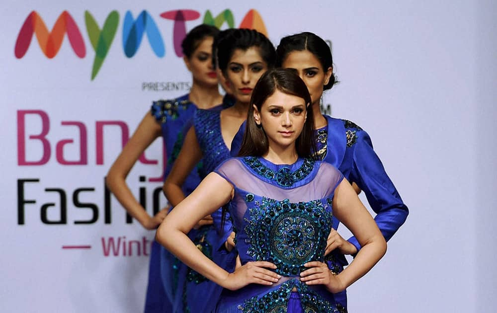 Actress Aditi Rao Hydari on the ramp to showcase the creation of designer Lalit Dalmia during the first day of Bangalore Fashion Week in Bengaluru.