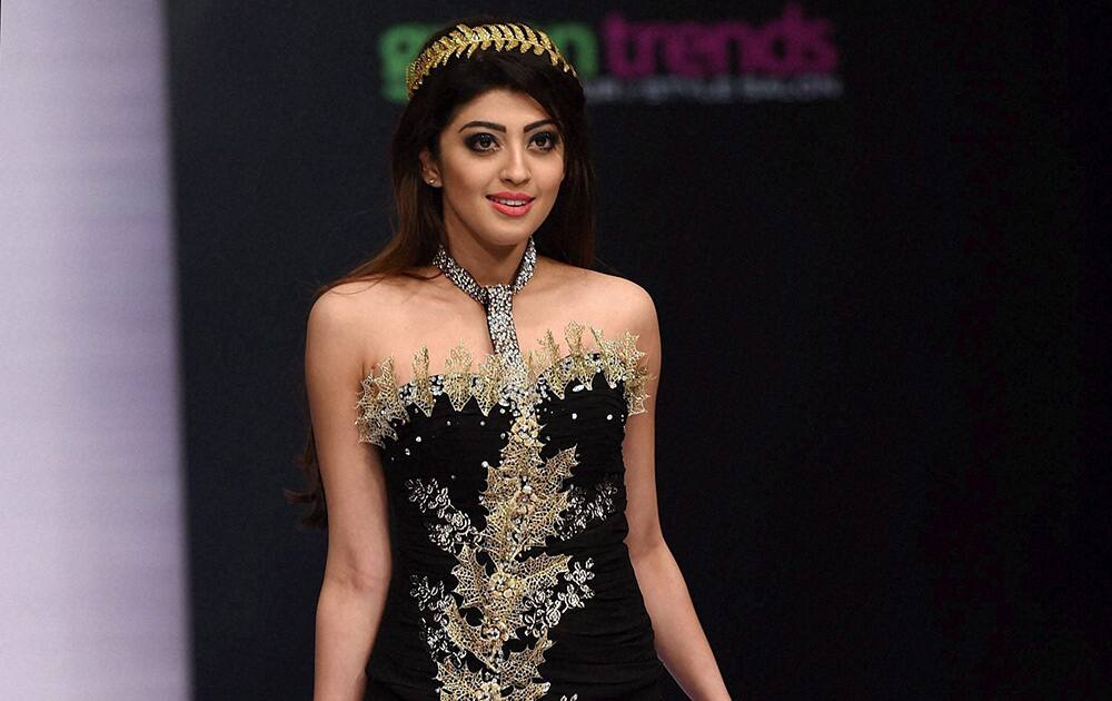 Actor Parneeta Subhash on the ramp to showcase the creation of designer Shivani Singh during the first day of Bangalore Fashion Week in Bengaluru.