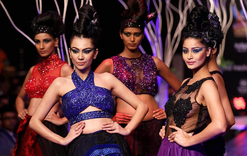 Models walk the ramp as they showcase the creation of designer Ramesh Dembla during the 3rd day of Bangalore Fashion Week.