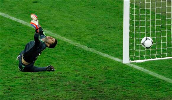 Greece goalkeeper Michalis Sifakis fails to make a save as Germany's Philipp Lahm, unseen, scores the opening goal during the Euro 2012 soccer championship quarterfinal match between Germany and Greece.