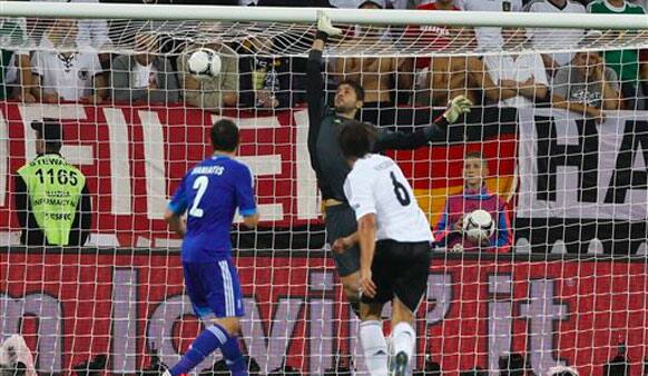 Germany's Sami Khedira, center, scores his side's second goal during the Euro 2012 soccer championship quarterfinal match between Germany and Greece.