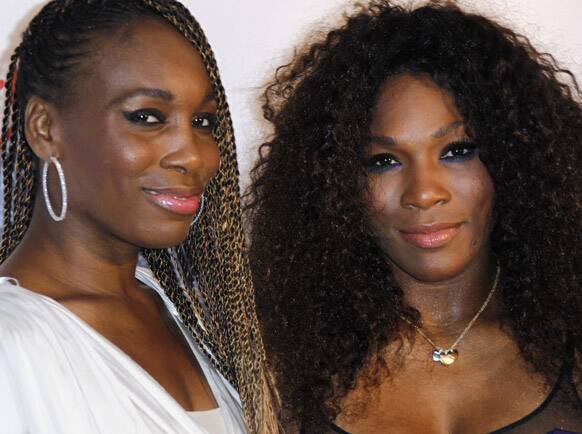 US tennis players and sister's Venus, and Serena Williams arrive for the Pre-Wimbledon Party, at Kensington Roof Gardens in west London.