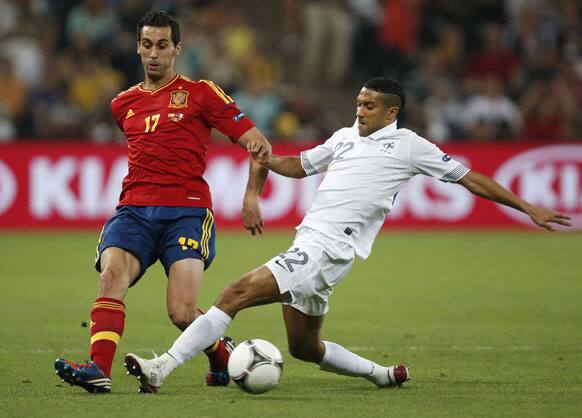 Spain's Alvaro Arbeloa makes a pass past France's Gael Clichy during the Euro 2012 soccer championship quarterfinal match between Spain and France in Donetsk, Ukraine, Saturday, June 23, 2012.