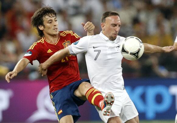 Spain's David Silva, left, challenges France's Franck Ribery during the Euro 2012 soccer championship quarterfinal match between Spain and France in Donetsk, Ukraine, Saturday, June 23, 2012. 