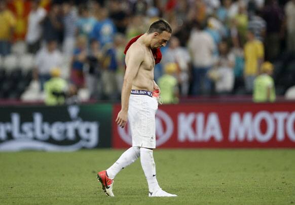 France's Franck Ribery walks on the pitch at the end of the Euro 2012 soccer championship quarterfinal match between Spain and France in Donetsk, Ukraine, Saturday, June 23, 2012. 