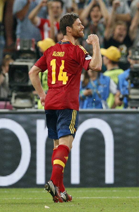 Spain's Xabi Alonso celebrates scoring his side's second goal during the Euro 2012 soccer championship quarterfinal match between Spain and France in Donetsk, Ukraine, Saturday, June 23, 2012.