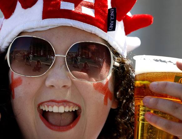 An England fan cheers in the fan zone in Kiev, Ukraine, Sunday, June 24, 2012. England will play Italy in a Euro 2012 quarterfinal soccer match later Sunday. 