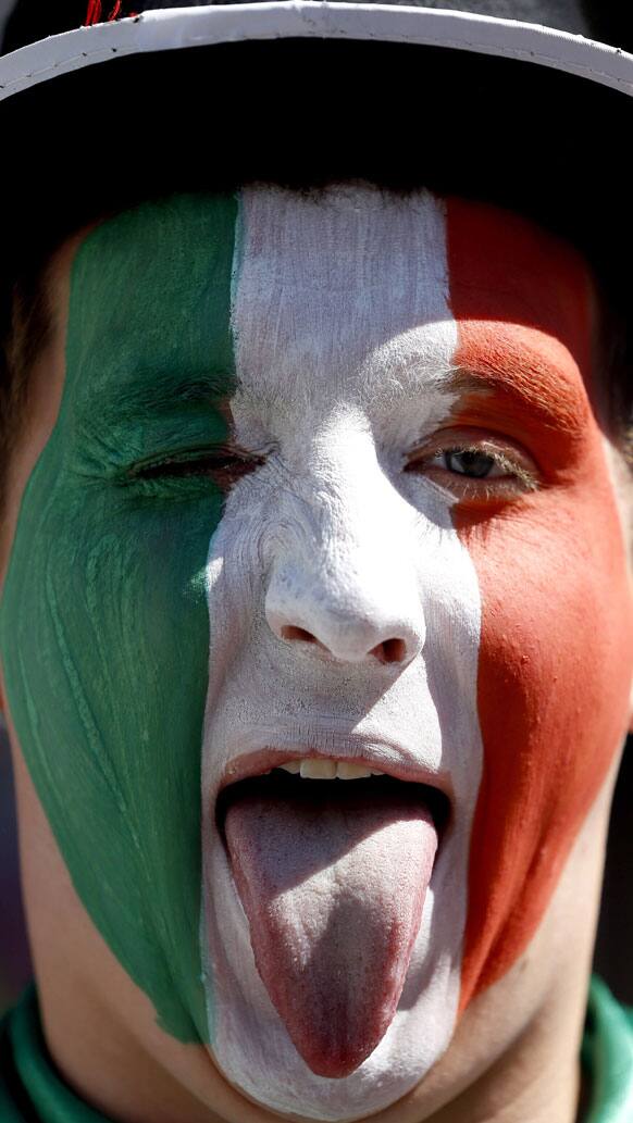 An Italy fan shows his tongue in the fan zone in Kiev, Ukraine, Sunday, June 24, 2012. Italy will play England in a Euro 2012 quarterfinal soccer match later Sunday. 