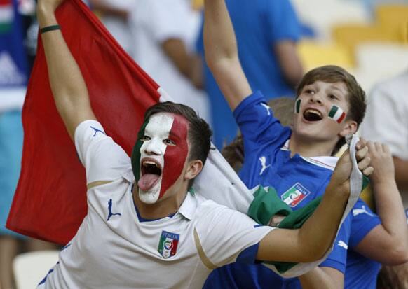 Italian fans cheer before the Euro 2012 soccer championship quarterfinal match between England and Italy in Kiev, Ukraine, Sunday, June 24, 2012.