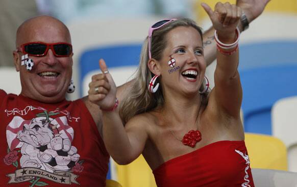 English fans cheer as they wait for the kick-off of the Euro 2012 soccer championship quarterfinal match between England and Italy in Kiev, Ukraine, Sunday, June 24, 2012.