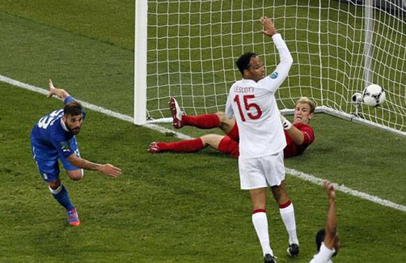 England's Joleon Lescott claims offside after Italy's Antonio Nocerino, left, scored a disallowed goal past England goalkeeper Joe Hart, right, during the Euro 2012 soccer championship quarterfinal match between England and Italy in Kiev, Ukraine.