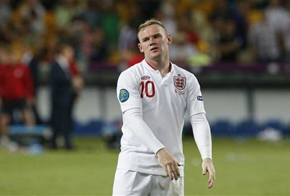 England's Wayne Rooney reacts after losing the penalty shootout of the Euro 2012 soccer championship quarterfinal match between England and Italy in Kiev, Ukraine. 