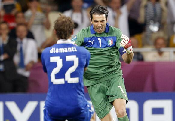 Italy goalkeeper Gianluigi Buffon, right, and Alessandro Diamanti celebrate after Diamanti scored the decisive penalty shootout during the Euro 2012 soccer championship quarterfinal match between England and Italy in Kiev, Ukraine.