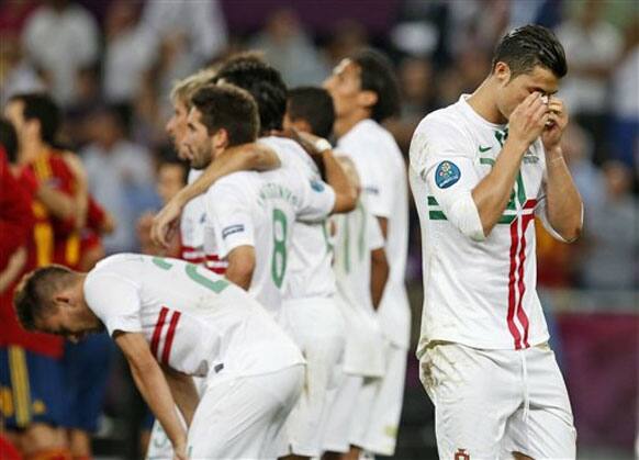 Portugal's Cristiano Ronaldo, right, reacts during the penalty shootout at the Euro 2012 soccer championship semifinal match between Spain and Portugal in Donetsk, Ukraine, Thursday, June 28, 2012.