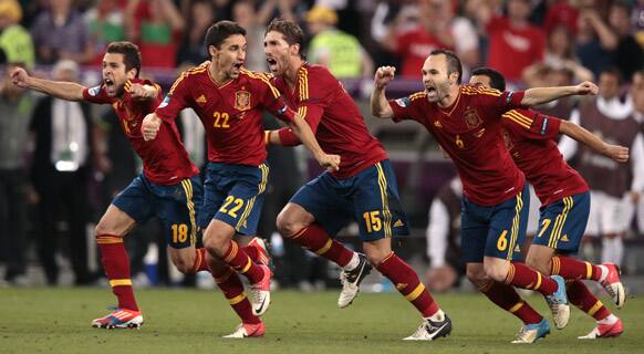 Spain's players celebrate after winning the penalty shootout during the Euro 2012 soccer championship semifinal match between Spain and Portugal in Donetsk, Ukraine.